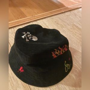 Black, corduroy bucket, hat with all sorts of stitched designs
